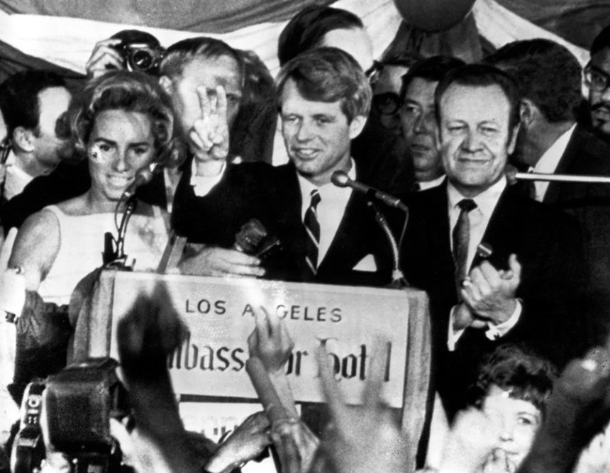 Sen. Robert F. Kennedy, D-N.Y., speaks to campaign workers, June 5, 1968, as his wife Ethel, left, and California campaign manager and speaker of the California Assembly, Jesse Unruh, look on, at the Ambassador Hotel in Los Angeles. (AP Photo)