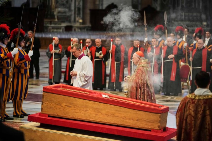 Cardinal Camerlengo Kevin Joseph Farrell, center right, spreads incense around the body of Pope Francis inside St. Peter's Basilica at the Vatican, Wednesday, April 23, 2025, where he will lie in state for three days. | Alessandra Tarantino, Associated Press
