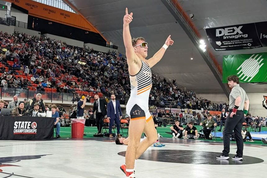 Idaho Falls’ DJ Neider dons a pair of shades as he celebrates his victory over Bishop Kelly’s Tensei Thompson in the 5A 150-pound finals at the Idaho High School Boys Wrestling State Championships, Saturday. | Kalama Hines, EastIdahoSports.com
