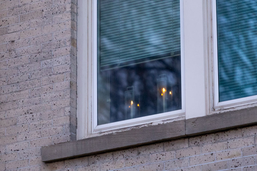 Two candles alit in one of the windows at the Bonneville County Courthouse | Daniel V. Ramirez, EastIdahoNews.com