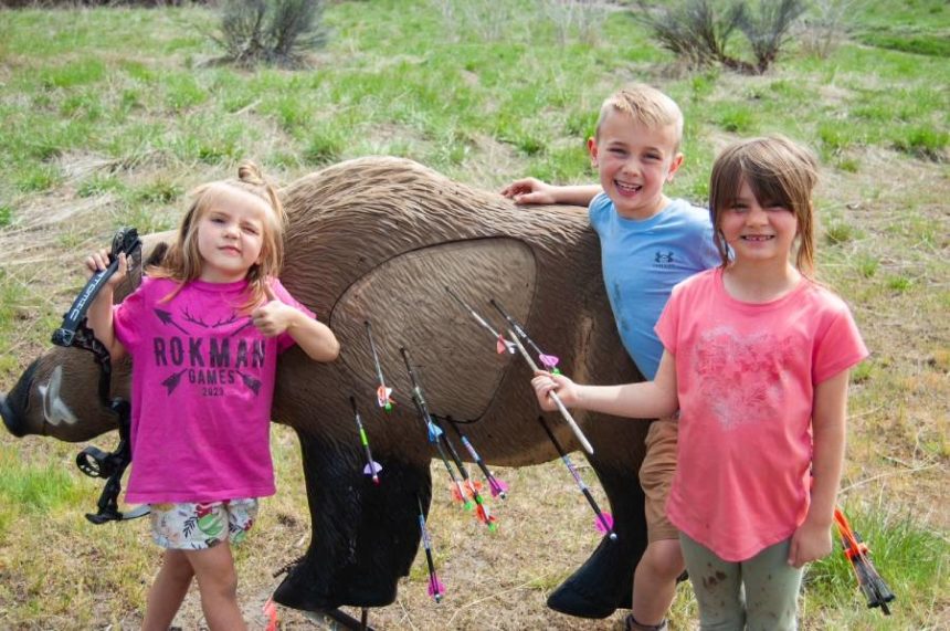 kids enjoying bow shooting
