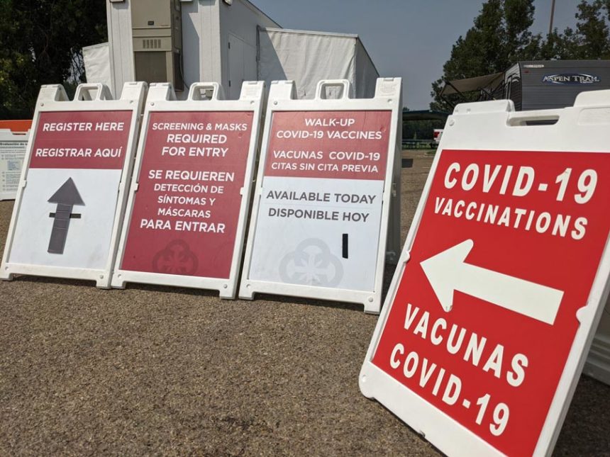 Signs lead people to a COVID-19 vaccination clinic set up at a park in Caldwell. | Idaho Capital Sun