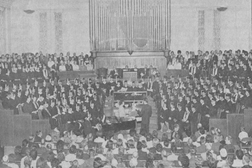 The largest graduating class in the history of the Rigby High School, 162, faces an audience of parents, relatives and friends. The auditorium was packed to capacity and with an additional 30 students to graduate next year, the upcoming commencement posses a seating problem for the class of '66. At the left of the picture are members of the faculty. All choir and rostrum seats were filled by graduates and the faculty members. Caption dated May 27, 1965.