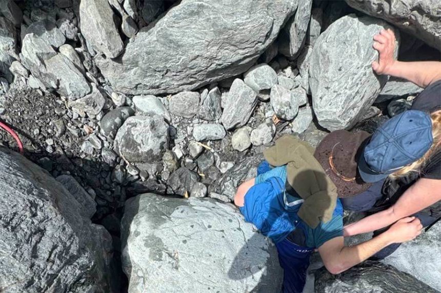 hiker pinned by boulder