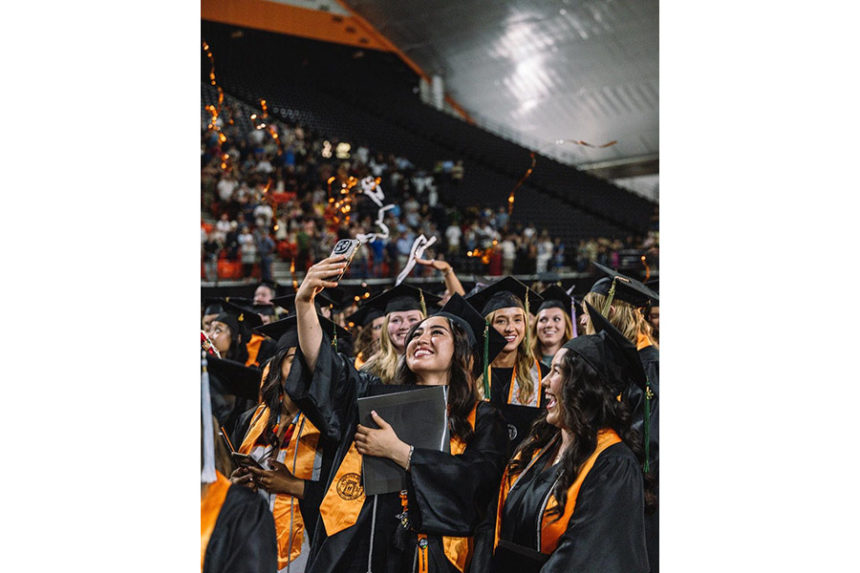 Idaho State University graduates taking a selfie at spring commencement | Courtesy ISU