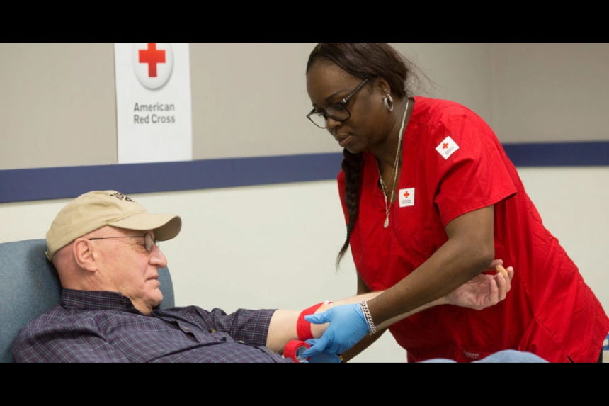 Man being treated by a nurse | redcrossblood.org
