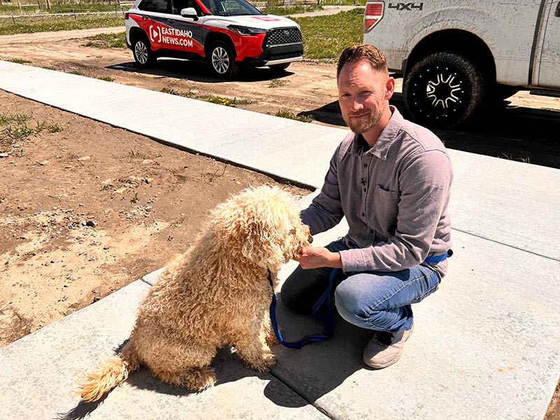 Thomas Nelson poses for a photo with his dog, Cooper.  | Rett Nelson, EastIdahoNews.com