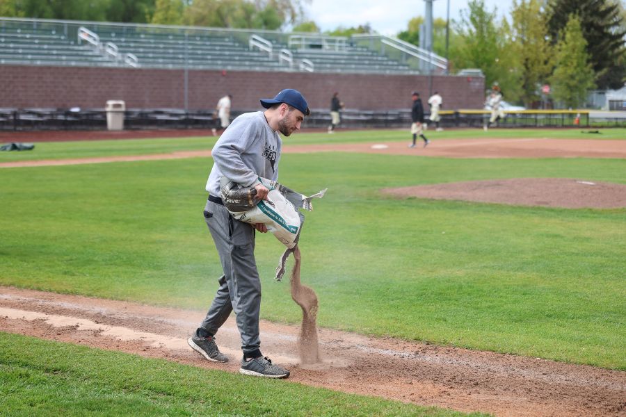 A grounds crew worker works on the field at Melaleuca Field following a rain storm and delay during Saturday's 4A championship game. | Courtesy photo.