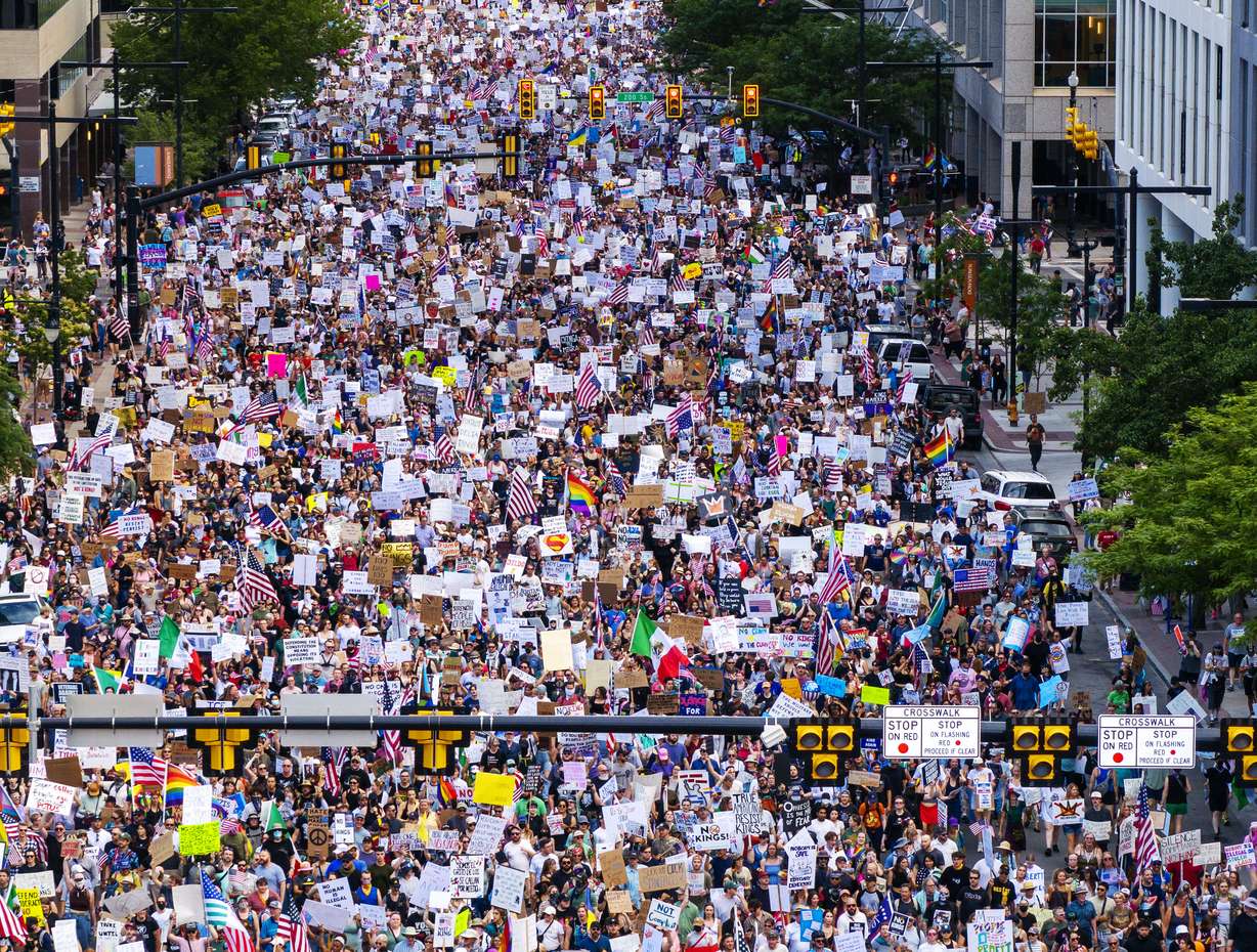 Protesters participate in a “No Kings” protest and march in Salt Lake City on Saturday. Arthur Folasa Ah Loo, 39, died Saturday after being shot during the protest and march in Salt Lake City on Saturday, police said. | Scott G Winterton, Deseret News