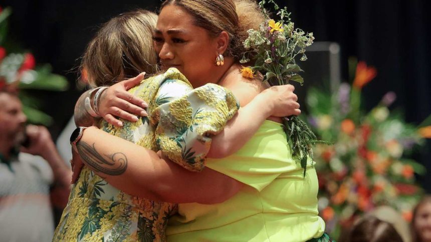Laura Empey, left, hugs Ashley Auva’a at a celebration of life for Laura’s husband, Afa Ah Loo, who was shot and killed as an innocent bystander during a No Kings protest, at the Salt Palace Convention Center in Salt Lake City on Friday. | Kristen Murphy, Deseret News