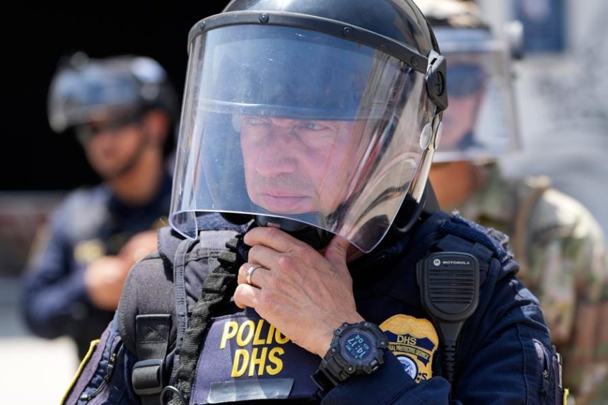 National Guard and DHS police stand guard outside the Metropolitan Detention Center, Wednesday, June 11, 2025, in Los Angeles. | Damian Dovarganes, Associated Press