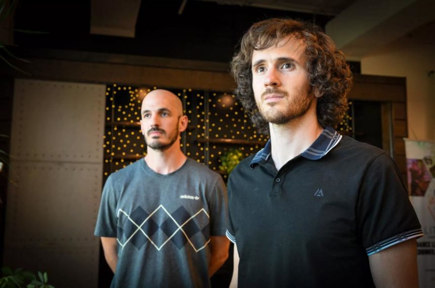 Andrew Mastronardi, left, stands in support of his brother Matthew, who was finishing his third year as a Spanish teacher to freshmen and sophomores at West Valley High. | Jesse Tinsley, The Spokesman-Review