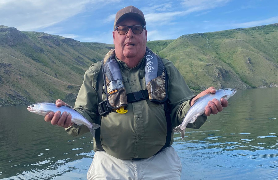Mike Bruton of Rigby, holds two 14 inch kokanee caught last week on Ririe Reservoir.