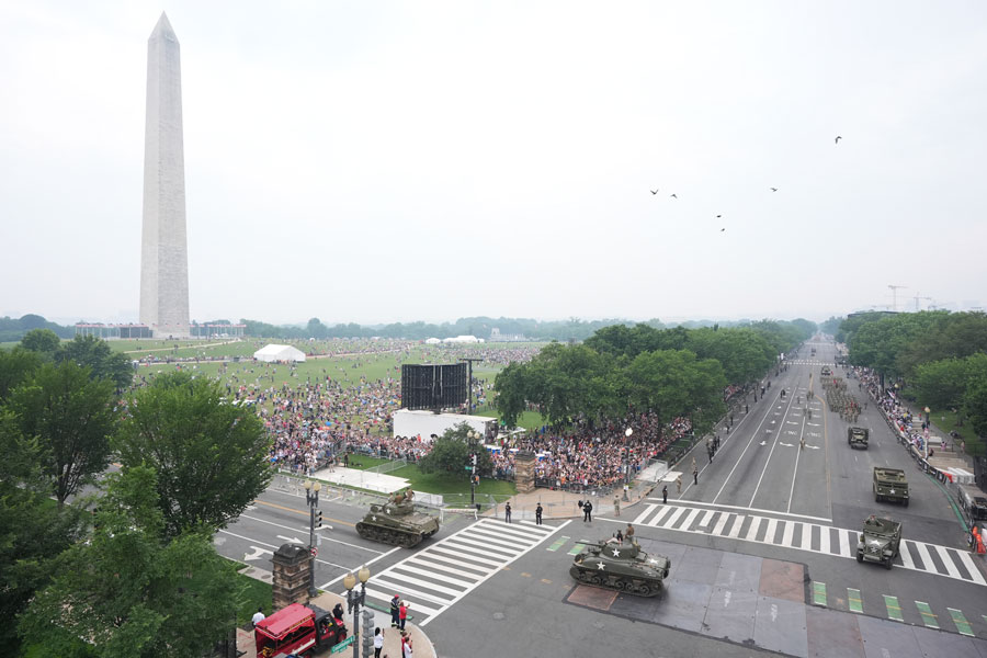 A military parade commemorating the Army's 250th anniversary and coinciding with President Donald Trump's 79th birthday, Saturday, June 14, 2025, in Washington. The Washington Monument stands left. (AP Photo/Jacquelyn Martin)