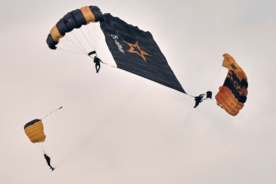 U.S. Army Parachute Team, nicknamed the Golden Knights, participate in the Army's 250th anniversary ceremony, coinciding with President Donald Trump's 79th birthday, Saturday, June 14, 2025, in Washington. (AP Photo/Jacquelyn Martin)