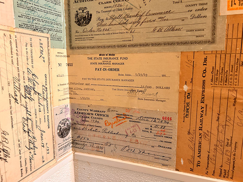 Financial documents from the old courthouse are now being used as wall decor in the McClure's bar. Among the myriad of documents on display is this check dating back to 1919. | Rett Nelson, EastIdahoNews.com