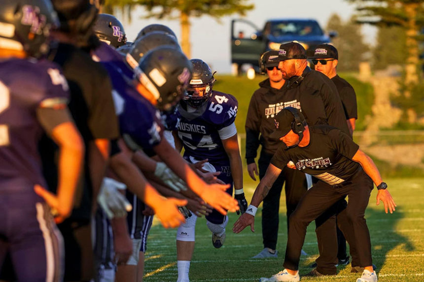 Keith Director, right, on the field with the North Fremont Huskies. During his first year as coach, he led the team to the quarterfinals. | Courtesy Keith Director