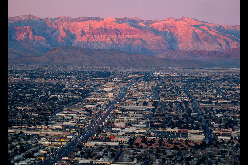FILE - A view of the suburbs of Las Vegas from atop the Stratosphere tower looking west down Sahara Ave., towards the Spring Mountains, Feb. 9, 2005. (AP Photo/Joe Cavaretta, File)