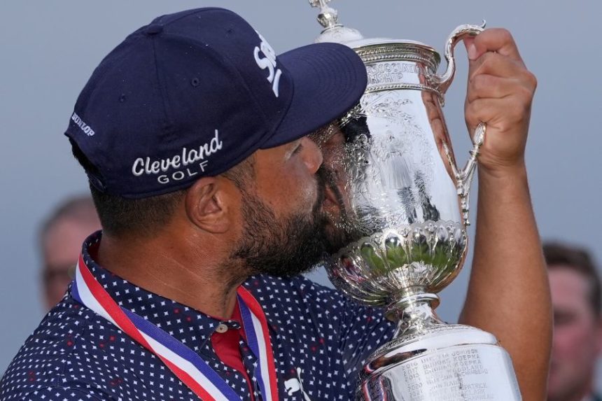 J.J. Spaun celebrates with the trophy after winning the U.S. Open golf tournament at Oakmont Country Club Sunday, June 15, 2025, in Oakmont, Pa. (AP Photo/Carolyn Kaster)