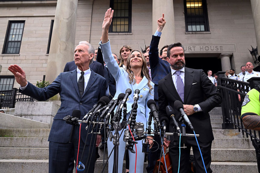 Karen Read, center, waves to supporters after she was found not guilty of second-degree murder on Wednesday, June 18, in Dedham, Massachusetts. Mandatory Credit: Josh Reynolds/AP via CNN Newsource