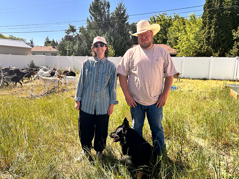 Maddie Hunsaker, left, poses for a photo with Zakary Copeland, right, and his dog. | Rett Nelson, EastIdahoNews.com