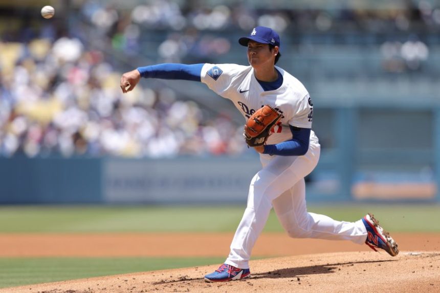 Los Angeles Dodgers starting pitcher Shohei Ohtani throws to a Washington Nationals batter during the first inning of a baseball game in Los Angeles, Sunday, June 22, 2025. (AP Photo/Jessie Alcheh)