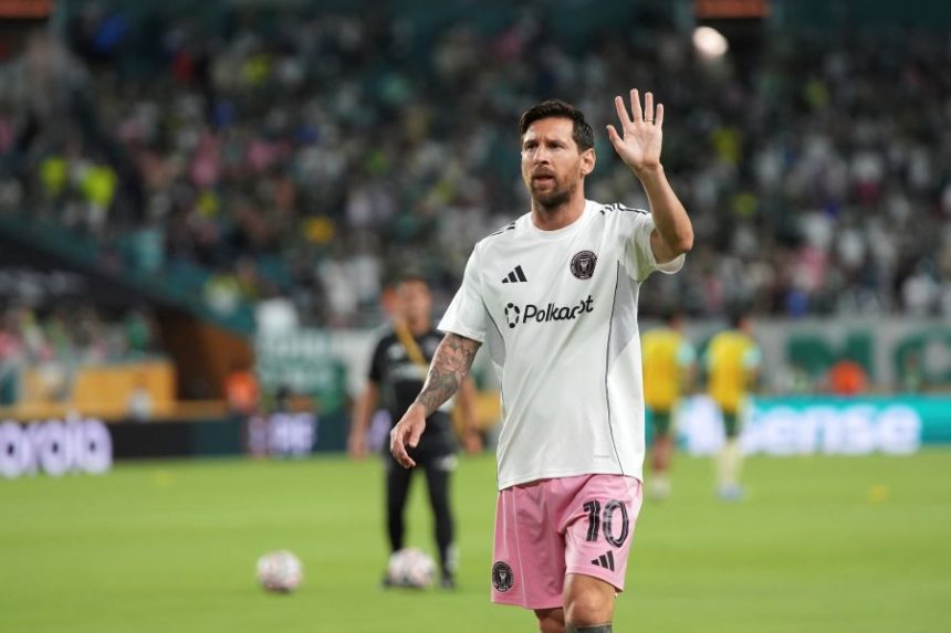 Inter Miami's Lionel Messi motions while warming up before the Club World Cup Group A soccer match between Inter Miami and Palmeiras in Miami Gardens, Fla., Monday, June 23, 2025. (AP Photo/Lynne Sladky)