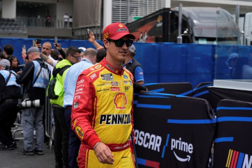Joey Logano walks to his car before a NASCAR Cup Series auto race at Hermanos Rodríguez race track in Mexico City, Sunday, June 15, 2025. (AP Photo/Fernando Llano)