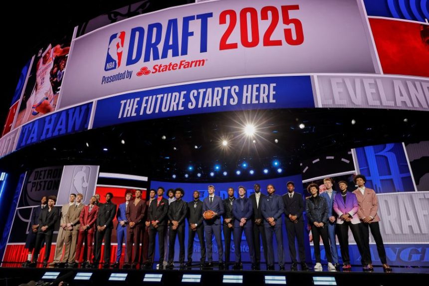 Prospective draft picks gather on stage for a photo before the first round of the NBA basketball draft, Wednesday, June 25, 2025, in New York. (AP Photo/Adam Hunger)