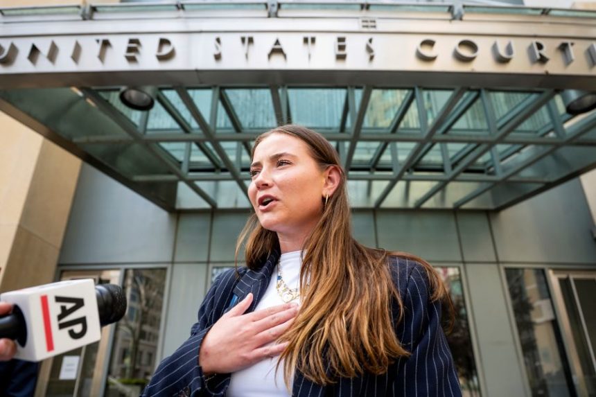 FILE - College soccer player Lexi Drumm leaves federal court during a hearing for a landmark $2.8 billion settlement impacting NCAA college athletics on Monday, April 7, 2025, in Oakland, Calif. (AP Photo/Noah Berger, FIle)