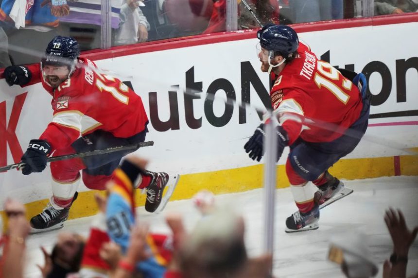 Florida Panthers' Sam Reinhart (13) celebrates after his goal against the Edmonton Oilers with teammate Matthew Tkachuk (19) during the third period in Game 4 of the NHL hockey Stanley Cup Final in Sunrise, Fla., Thursday, June 12, 2025. (Nathan Denette/The Canadian Press via AP)