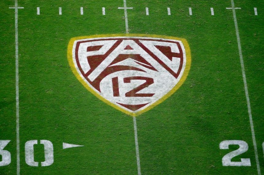 FILE - The Pac-12 logo at Sun Devil Stadium during the second half of an NCAA college football game between Arizona State and Kent State in Tempe, Ariz., Aug. 29, 2019. (AP Photo/Ralph Freso, File) FILE - The Pac-12 logo at Sun Devil Stadium during the second half of an NCAA college football game between Arizona State and Kent State in Tempe, Ariz., Aug. 29, 2019. (AP Photo/Ralph Freso, File)