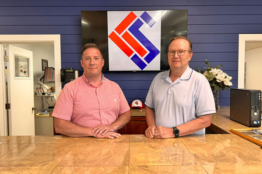 Patrick Bjornn, left, and Blair Rigby pose for a photo inside Showcase Interiors Flooring America at 1373 South Railroad Avenue in Rexburg. Rigby helped launch the company 50 years ago. The company is celebrating that milestone. | Rett Nelson, EastIdahoNews.com