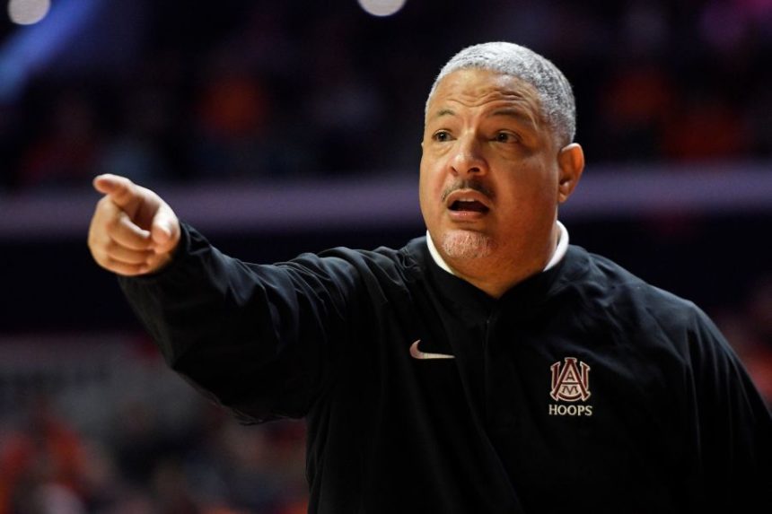 FILE - Former Alabama A&M head coach Otis Hughley Jr. signals during the second half of an NCAA college basketball game against Illinois on Dec. 17, 2022, in Champaign, Ill. (AP Photo/Michael Allio, File)