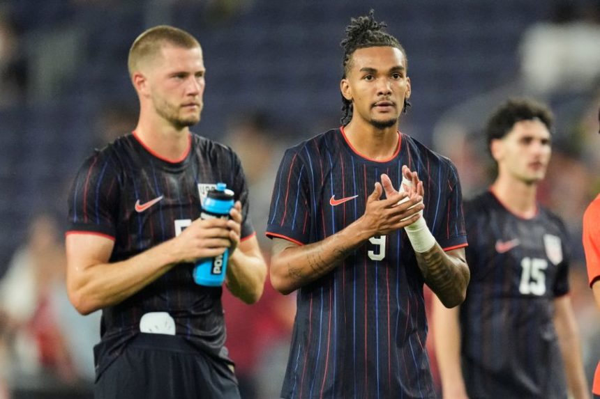 United States forward Damion Downs (9) and defender Walker Zimmerman, right, look to the fans after the team's loss in an international friendly soccer match against the Switzerland, Tuesday, June 10, 2025, in Nashville, Tenn. (AP Photo/George Walker IV)