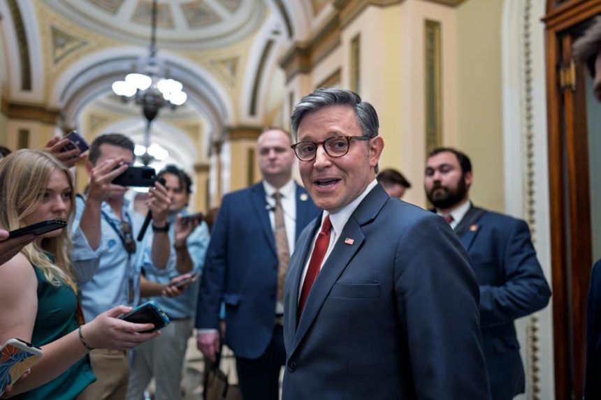 Speaker of the House Mike Johnson, R-La., pauses to speak to reporters as he enters the chamber to prepare for final passage of President Donald Trump's signature bill of tax breaks and spending cuts, at the Capitol in Washington, Thursday, July 3, 2025. | J. Scott Applewhite, Associated Press
