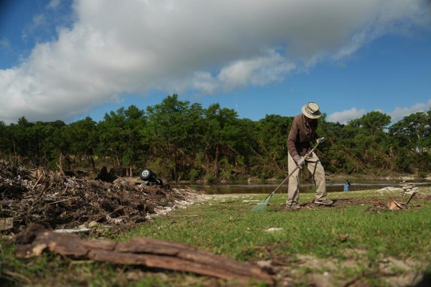 Charles Hanson, 91, cleans up flood debris, Tuesday, July 8, 2025, at Guadelupe Park in Kerrville, Texas. | Joshua A. Bickel, Associated Press