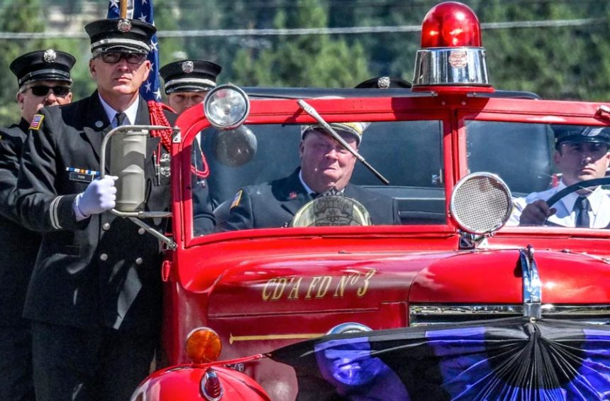 Members of the Coeur d’Alene Fire Department transport the body of CdA Battalion Chief John Morrison during the procession for his funeral in Coeur d’Alene on Thursday. Morrison and Kootenai Fire & Rescue Battalion Chief Frank Harwood were shot and killed while tending to a fire on Canfield Mountain on June 29. | Kathy Plonka, The Spokesman-Review