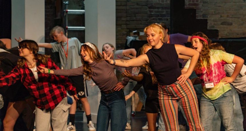 Cast members practice the choreography for one of many musical numbers to be featured in the production of the popular musical, "Annie Jr.," this weekend in Rexburg. | Courtesy Tom Bugg.