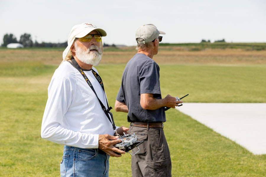 Club members Jim Dokos, left, and Art Rood watching their RC planes fly at the club's flying field in Idaho Falls. | Daniel V. Ramirez, EastIdahoNews.com