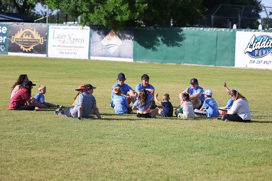 Grays players and young fans enjoy the Reading in the Outfield portion of the annual charity night.