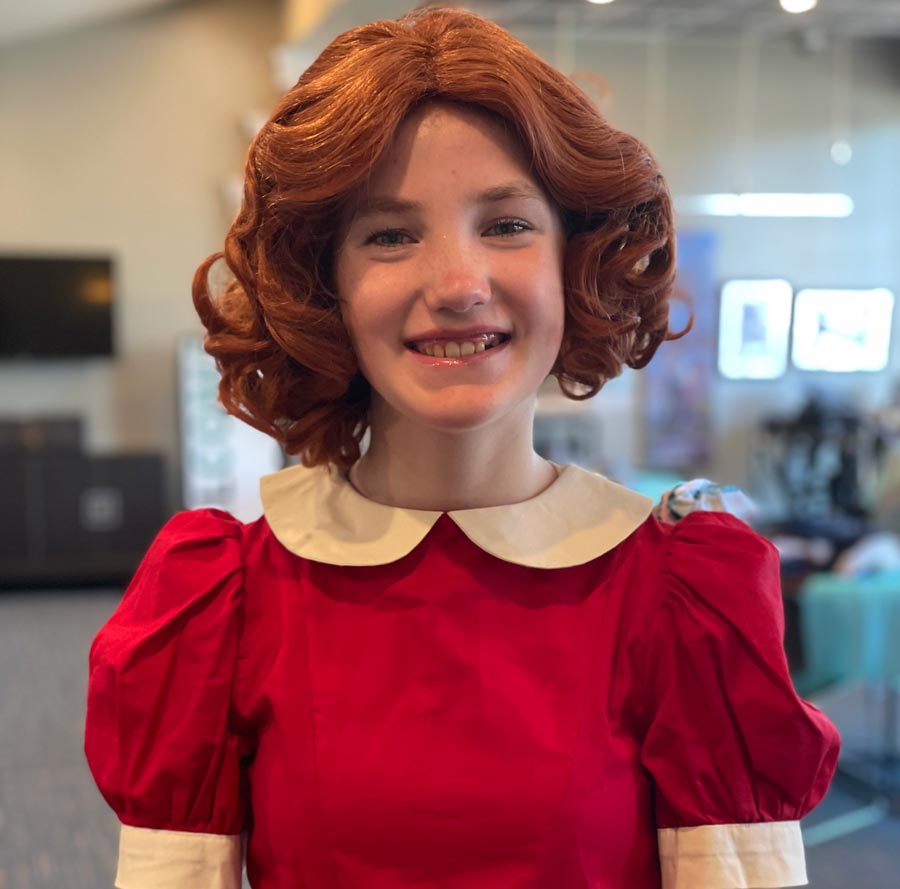 Bria Larsen dons her red wig for the first time, in preparation to play the part of Annie in Rexburg Cultural Arts' production of "Annie Jr." | Courtesy Kaatia Larsen
