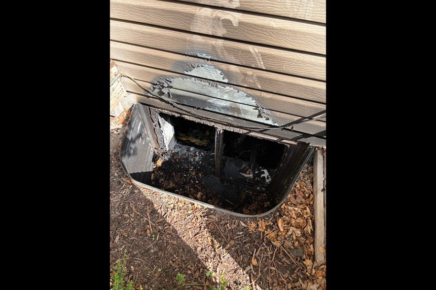 A burned window well from the house.