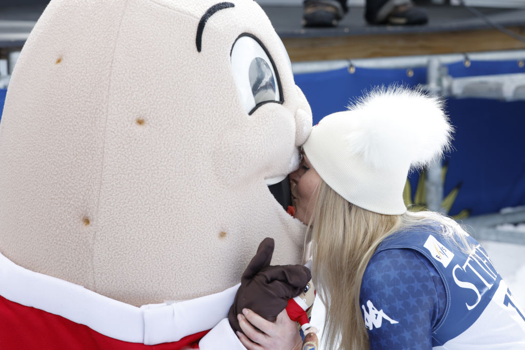 Lindsey Vonn of Team United States, shares a moment with Spuddy Buddy, the mascot of the Idaho Potato Commission, on March 23, 2025, in Sun Valley, Idaho. Vonn took second place during the Audi FIS Alpine Ski World Cup Men’s and Women’s Super G, becoming the oldest woman to take the podium in a skiing World Cup at age 40. Established in 1937, the Idaho Potato Commission is a state agency that is responsible for promoting and protecting the famous “Grown in Idaho” seal, a federally registered trademark that assures consumers they are purchasing genuine, top-quality Idaho potatoes, according to its website. | Christophe Pallot, Agence Zoom via Getty Images