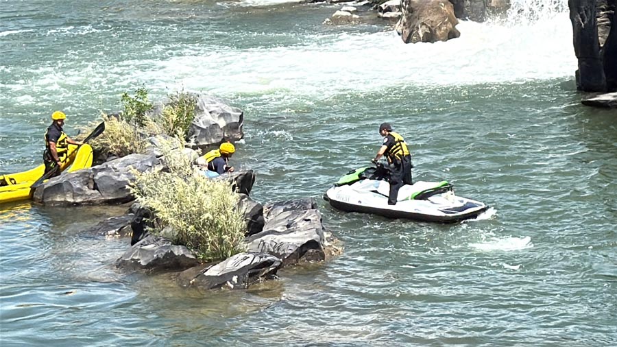 Deputies working to save two men who fell into the Snake River when their boat flipped. | Bonneville County Sheriff's Office