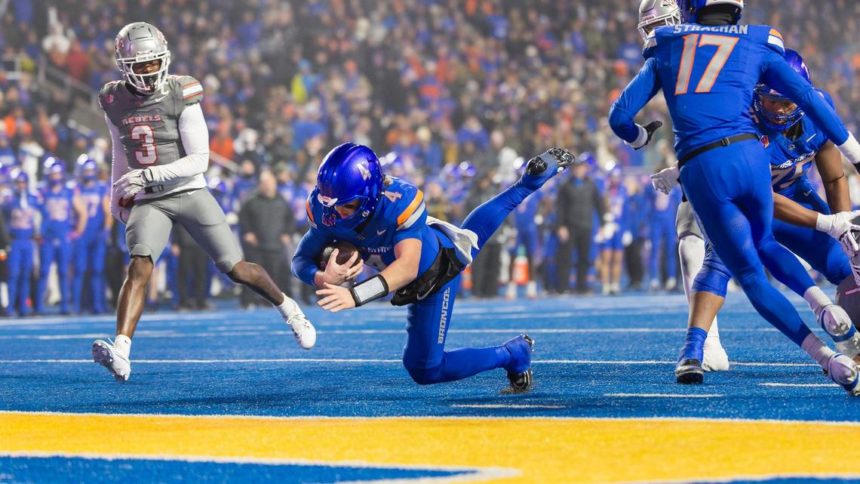 Boise State quarterback Maddux Madsen scores a touchdown against UNLV in the second quarter of the Mountain West championship game at Albertsons Stadium. Sarah A. Miller smiller@idahostatesman.com