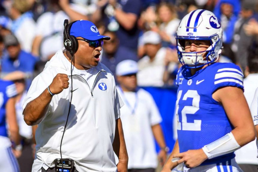 BYU head coach Kalani Sitake, left, celebrates an overturned play call after review during an NCAA college football game against Arizona, Saturday, Oct. 12, 2024, in Provo, Utah. (Photo: Tyler Tate, Associated Press)