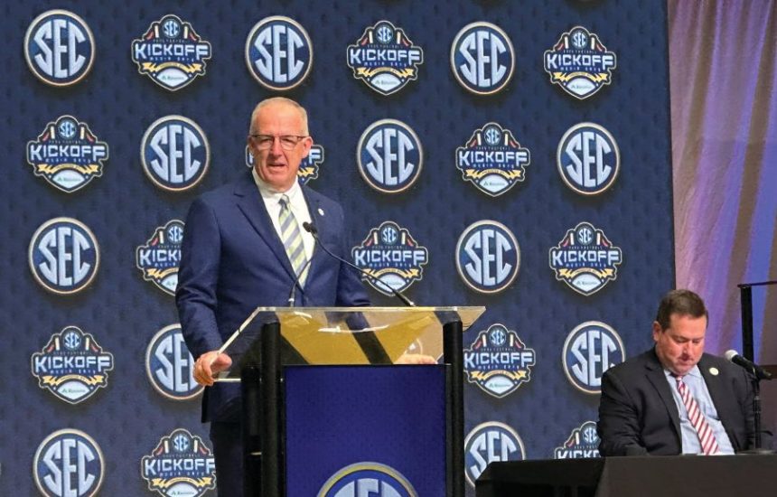 SEC Commissioner Greg Sankey discusses the annual conference highlights with Communications Director Chuck Dunlap sitting at the College Football Hall of Fame in Atlanta, Monday, July 14, 2025. (Hunter Dawkins/The Gazebo Gazette via AP)