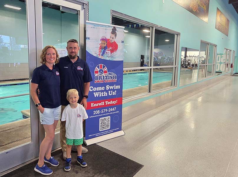 Kyla and Josh Danos with their 4-year-old son at the Gold's Gym swimming pool. | Courtesy Kyla Danos