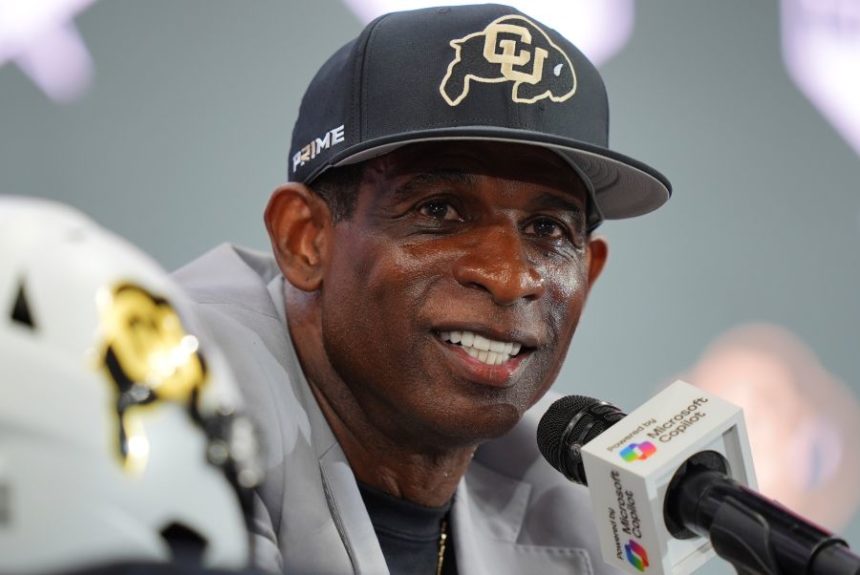 Colorado head coach Deion Sanders listens to a question during the Big 12 NCAA college football media day in Frisco, Texas, Wednesday, July 9, 2025. (AP Photo/LM Otero)